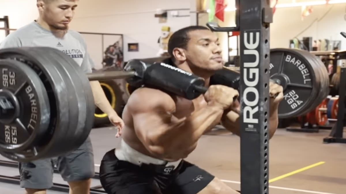 Larry Wheels Squats 495 Pounds For 15 Reps